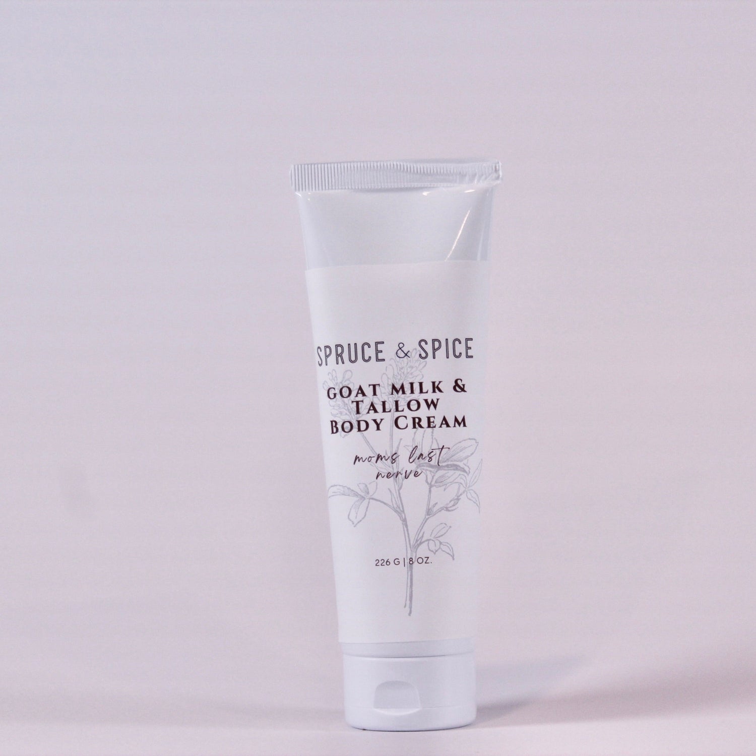 Body cream tube labeled &