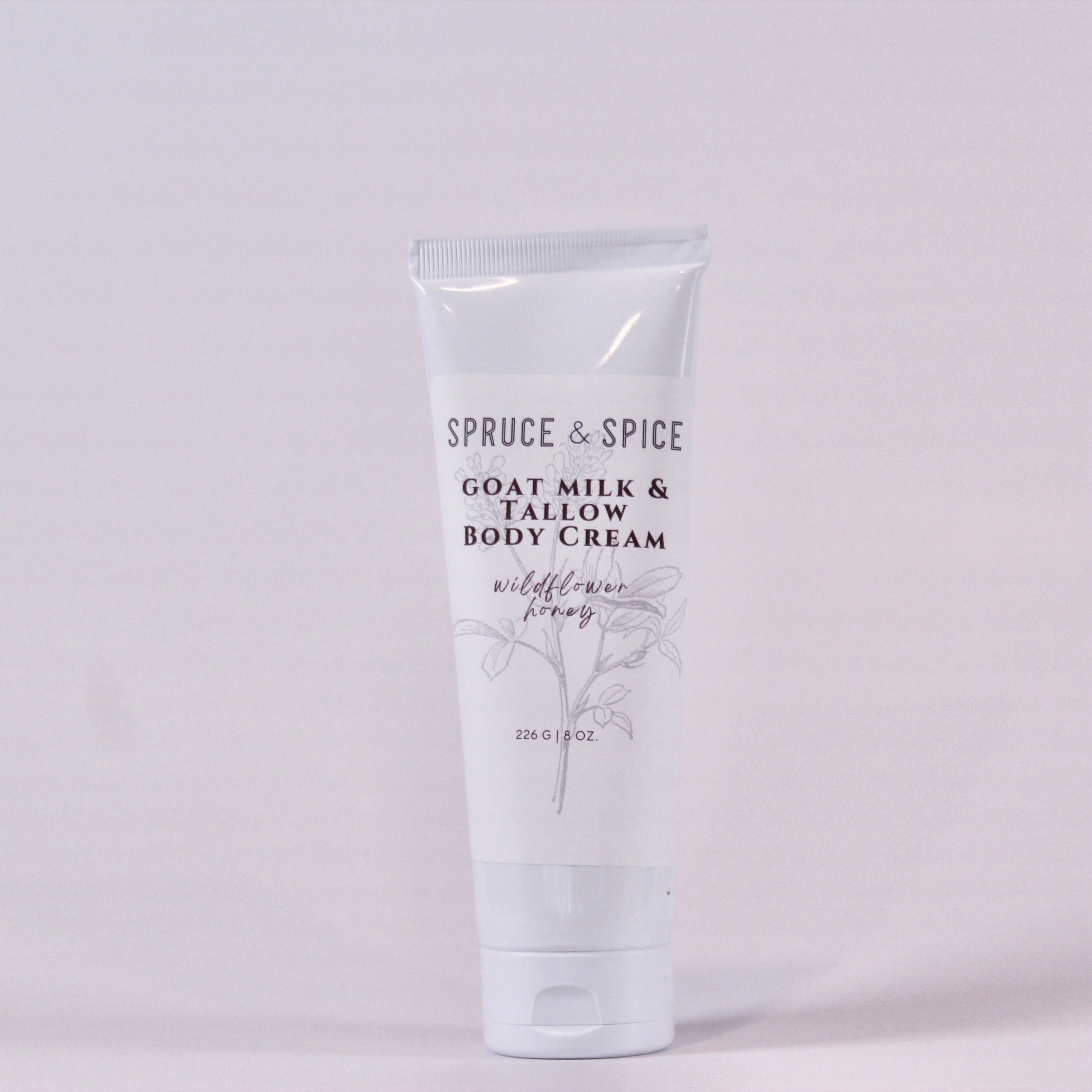 Body cream tube labeled &
